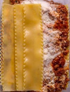 Chef Ed, lasagna recipe, Italian lasagna, lasagna bolognese, classic Italian dish, homemade lasagna, pasta recipes, beef lasagna, pork lasagna, béchamel sauce, ragù, San Marzano tomatoes, traditional lasagna, layered pasta, lasagna from scratch, comfort food, baked pasta, Italian comfort food, cheesy lasagna, creamy béchamel, lasagna dinner, chef Ed cooking, lasagna masterclass, authentic lasagna, pasta masterpiece, homemade bolognese, red wine sauce, creamy pasta dish, meat sauce lasagna, dinner for guests, dinner party recipe, Sunday dinner, chef’s lasagna, food with love, lasagna layers, pasta bake, golden cheese topping, lasagna with wine, Italian home cooking, lasagna with béchamel, kitchen legend, chef-approved dinner, lasagna perfection, deep dish lasagna, oven baked pasta, dinner showstopper, hearty meal, perfect lasagna