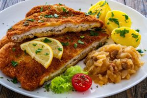 Tag words: schnitzel recipe, chef Ed, Wiener Schnitzel, pork schnitzel, chicken schnitzel, German food, Austrian cuisine, comfort food, traditional schnitzel, how to make schnitzel, European recipes, golden crust, crispy schnitzel, homemade schnitzel, breaded cutlet, meat recipe, veal schnitzel, classic dinner, schnitzel history, cultural food, fried meat, holiday food, German dinner, easy dinner idea, protein meal, traditional dish, lemon schnitzel, breadcrumb recipe, culinary classic, chef Ed recipe, meat lover, schnitzel side dishes, clarified butter, pan-fried schnitzel, schnitzel meal, food heritage, world cuisine, European classic, dinner for four, home cooking, schnitzel tips, German cooking, heritage food, iconic dish, recipe history, schnitzel with salad, meat main course, schnitzel tradition