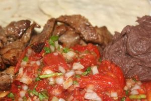 grilled steak recipe, Chef Ed recipe, Guatemalan chimol, tomato salsa, black beans, sauteed beans, garlic and onion beans, Latin steak dinner, corn tortillas, Guatemalan food, Central American cuisine, post workout dinner, healthy Latin meal, handmade tortillas, skirt steak, flank steak, citrus steak marinade, chimol topping, salsa fresca, fitness-friendly steak dinner, protein rich meal, authentic Guatemalan recipe, charred steak, Chef Ed kitchen, Latin American grill recipe, homemade black beans, lime marinated steak, muscle recovery dinner, tortillas and beans, steak with salsa, chimol with cilantro