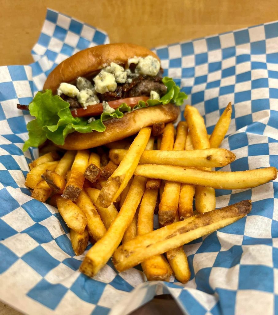 Chef Ed recipe, bacon blue cheese burger, gourmet burger, juicy burger, American classic, hamburger recipe, beef and bacon burger, blue cheese beef, homemade burger, oven fries, creamy cole slaw, comfort food, pub-style burger, BBQ burger plate, thick burger patty, toasted brioche bun, bacon cheeseburger, cookout meal, burger night, beef dinner, classic side dishes, game day food, crispy fries, mayonnaise slaw, shredded cabbage salad, backyard burger, seared burger, skillet burger, family meal, indulgent sandwich