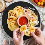 Keywords: pupusas, Salvadoran food, cheese pupusa, pupusas revueltas, masa harina recipe, Chef Ed, curtido slaw, salsa roja, Central American street food, grilled pupusa, gluten-free Latin food, Latin comfort food, pupusas de queso, pork pupusa, authentic pupusas, Loroco filling, homemade tortillas, Salvadoran cuisine, El Salvador recipes, Latin cheese dish, Latin American cuisine, fermented cabbage, healthy Latin meals, corn tortilla pupusa, stuffed masa dough, cheesy Latin snack, meat and cheese pupusa, pupusas tradition, Chef Ed pupusa recipe