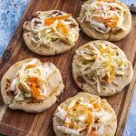 Keywords: pupusas, Salvadoran food, cheese pupusa, pupusas revueltas, masa harina recipe, Chef Ed, curtido slaw, salsa roja, Central American street food, grilled pupusa, gluten-free Latin food, Latin comfort food, pupusas de queso, pork pupusa, authentic pupusas, Loroco filling, homemade tortillas, Salvadoran cuisine, El Salvador recipes, Latin cheese dish, Latin American cuisine, fermented cabbage, healthy Latin meals, corn tortilla pupusa, stuffed masa dough, cheesy Latin snack, meat and cheese pupusa, pupusas tradition, Chef Ed pupusa recipe