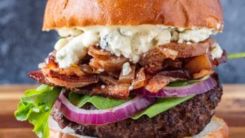 Chef Ed recipe, bacon blue cheese burger, gourmet burger, juicy burger, American classic, hamburger recipe, beef and bacon burger, blue cheese beef, homemade burger, oven fries, creamy cole slaw, comfort food, pub-style burger, BBQ burger plate, thick burger patty, toasted brioche bun, bacon cheeseburger, cookout meal, burger night, beef dinner, classic side dishes, game day food, crispy fries, mayonnaise slaw, shredded cabbage salad, backyard burger, seared burger, skillet burger, family meal, indulgent sandwich