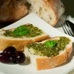 Keywords: pesto recipe, Chef Ed pesto, basil pesto, classic pesto sauce, meat pesto pairings, vegetarian pesto meals, homemade pesto, pesto for chicken, pesto pasta, pesto with steak, easy pesto recipe, olive oil sauce, nut-free pesto option, garlic basil pesto, summer sauce, Italian sauce, healthy pesto ideas, pesto for roasted veggies, pesto on fish, pesto with portobello, caprese with pesto, pesto grilled salmon, fresh herb sauce, pesto aioli, how to make pesto, vegetarian Italian food, pesto pasta primavera, pesto pizza sauce, basil garlic olive oil sauce