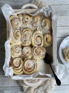 Keywords: cinnamon buns, cinnamon rolls, homemade cinnamon buns, Chef Ed recipe, fluffy rolls, sweet breakfast, brunch recipe, cream cheese glaze, cinnamon sugar, baked goods, fresh rolls, gooey rolls, cinnamon swirl, sweet dough, dessert buns, soft rolls, yeast rolls, baking recipe, cinnamon filling, breakfast treat, pastry recipe, homemade dessert, bakery buns, easy cinnamon rolls, warm cinnamon, breakfast pastry, holiday baking, sticky buns, vanilla glaze, comfort food. 1/2