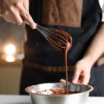 **Tag Words:** triple layered chocolate cake, Chef Ed, decadent dessert, rich chocolate, chocolate ganache, layered cake, gourmet baking, moist chocolate cake, chocolate lover dessert, homemade cake, bakery style, elegant dessert, celebration cake, fudge frosting, chocolate indulgence, three layer cake, dark chocolate, creamy ganache, party dessert, special occasion cake, chocolate masterpiece, chocolate filling, dessert recipe, chocolate layers, layered ganache cake, cake recipe, baked from scratch, chocolate fantasy, chef-inspired dessert, showstopper cake, chocolate decadence