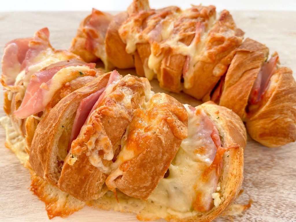 Chef Ed’s croissants are buttery, flaky, and filled three ways: ham & Swiss, dark chocolate, and blueberry-ricotta. Plus: pillowy chocolate beignets dusted in sugar — brunch perfection!