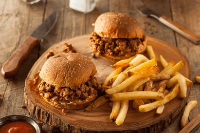 Chef Ed recipe, sloppy joe, ground beef sandwich, comfort food, American classic, homemade sloppy joe, coleslaw recipe, crispy fries, diner-style meal, beefy sandwich, ketchup-based sauce, messy sandwich, brioche bun, baked fries, shredded cabbage slaw, creamy coleslaw, quick dinner, easy family meal, game day food, cookout ideas, juicy ground beef, Texas-style sandwich, barbecue side dish, beef recipes, sandwich night, hearty meal, saucy sandwich, homemade fast food, summer dinner, classic American dish