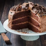 **Tag Words:** triple layered chocolate cake, Chef Ed, decadent dessert, rich chocolate, chocolate ganache, layered cake, gourmet baking, moist chocolate cake, chocolate lover dessert, homemade cake, bakery style, elegant dessert, celebration cake, fudge frosting, chocolate indulgence, three layer cake, dark chocolate, creamy ganache, party dessert, special occasion cake, chocolate masterpiece, chocolate filling, dessert recipe, chocolate layers, layered ganache cake, cake recipe, baked from scratch, chocolate fantasy, chef-inspired dessert, showstopper cake, chocolate decadence