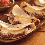 Keywords: baleadas, Honduras food, Chef Ed recipe, grilled meats, Latin street food, refried beans, flour tortilla, carne asada baleada, grilled pork baleada, grilled chicken baleada, authentic Honduran recipe, Latin American cuisine, comfort food, protein-packed meal, street food fusion, traditional Central American food, crema and queso, handmade tortillas, flavorful fillings, food truck favorite, hearty baleadas, layered tortillas, avocado and beans, grilled meat wrap, Latin fusion food, Chef Ed baleadas, Central American recipes, tasy baleada comboChef