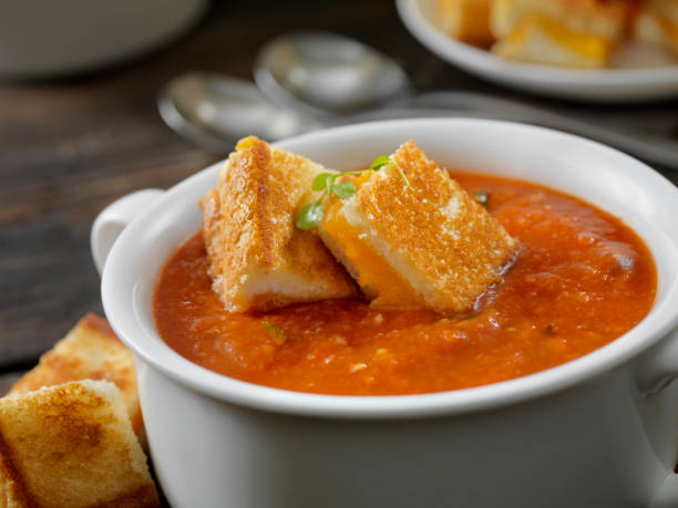 tomato, soup, grilled cheese, comfort food, homemade, classic, lunch, dinner, easy recipe, creamy, crispy, sandwich, cheddar, sourdough, onions, garlic, tomato paste, San Marzano, canned tomatoes, fresh tomatoes, broth, heavy cream, butter, olive oil, immersion blender, quick meal, cozy, family favorite, cheese pull, gooey, toasted, pan-grilled, savory, tangy, smooth, sharp cheddar, rustic bread, melt, garlic powder, Dijon mustard, golden brown, comfort, fall recipe, winter food, nostalgic, childhood favorite, easy cooking, meal prep, soup and sandwich, hearty, rich flavor, indulgent