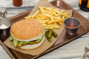 breaded fish burger, Chef Ed fish sandwich, crispy fish fillet, homemade tartar sauce, fish sandwich recipe, french fries, buttered buns, cod burger, panko fish, healthy fast food, athlete-friendly meal, tomato and lettuce burger, post workout sandwich, fish and chips sandwich, tartar sauce recipe, crispy fish sandwich, easy fish burger, gourmet fish burger, classic American lunch, comfort food recipe, chef ed kitchen, pan-fried fish, golden breaded fish, toasted sandwich buns, double fried fries, high protein sandwich, crispy seafood burger, dill pickles, red onion topping, chef ed burger recipe