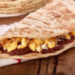 Keywords: baleadas, Honduras food, Chef Ed recipe, grilled meats, Latin street food, refried beans, flour tortilla, carne asada baleada, grilled pork baleada, grilled chicken baleada, authentic Honduran recipe, Latin American cuisine, comfort food, protein-packed meal, street food fusion, traditional Central American food, crema and queso, handmade tortillas, flavorful fillings, food truck favorite, hearty baleadas, layered tortillas, avocado and beans, grilled meat wrap, Latin fusion food, Chef Ed baleadas, Central American recipes, tasy baleada comboChef