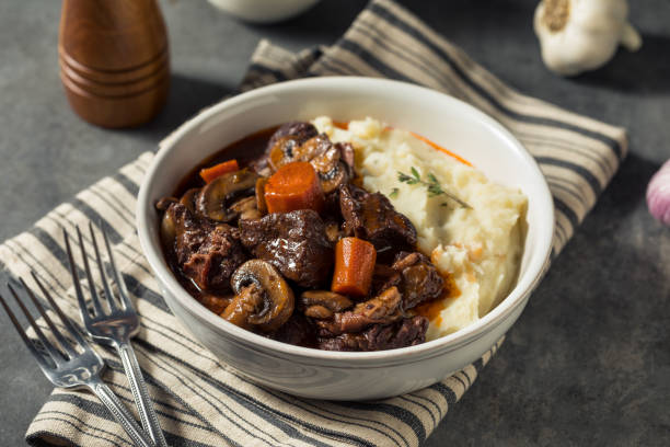 beef bourguignon recipe, classic French beef stew, Chef Ed beef recipes, wine braised beef, boeuf bourguignon, winter comfort food, Dutch oven recipes, hearty beef stew, slow-cooked beef