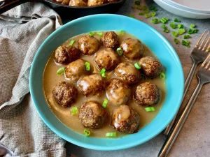 meatballs, brown sauce, Chef Ed, beef meatballs, pork and beef, savory dinner, classic comfort food, skillet meal, mashed potatoes and gravy, rich sauce, gravy meatballs, juicy meatballs, easy dinner, homemade recipe, sauce from scratch, buttery roux, egg noodles, Swedish meatballs, hearty meal, ground beef, kitchen comfort, rich beef sauce, family dinner, tasty meatballs, meatball recipe, simple brown sauce, rustic dinner, gourmet home cooking, oven to table, parsley garnish, meatball gravy, creamy sauce option, ultimate meatballs, skillet dish, home-style cooking, indulgent sauce, cozy food, classic gravy, ground pork option, satisfying meal, winter comfort, stovetop recipe