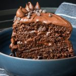 **Tag Words:** triple layered chocolate cake, Chef Ed, decadent dessert, rich chocolate, chocolate ganache, layered cake, gourmet baking, moist chocolate cake, chocolate lover dessert, homemade cake, bakery style, elegant dessert, celebration cake, fudge frosting, chocolate indulgence, three layer cake, dark chocolate, creamy ganache, party dessert, special occasion cake, chocolate masterpiece, chocolate filling, dessert recipe, chocolate layers, layered ganache cake, cake recipe, baked from scratch, chocolate fantasy, chef-inspired dessert, showstopper cake, chocolate decadence